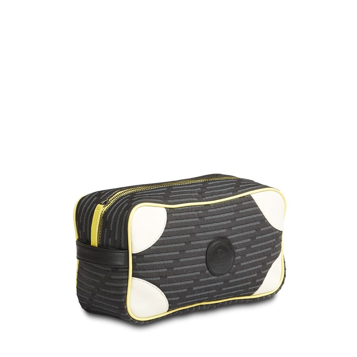 Trousse de toilette noire à motifs, garnitures blanches et zip jaune.