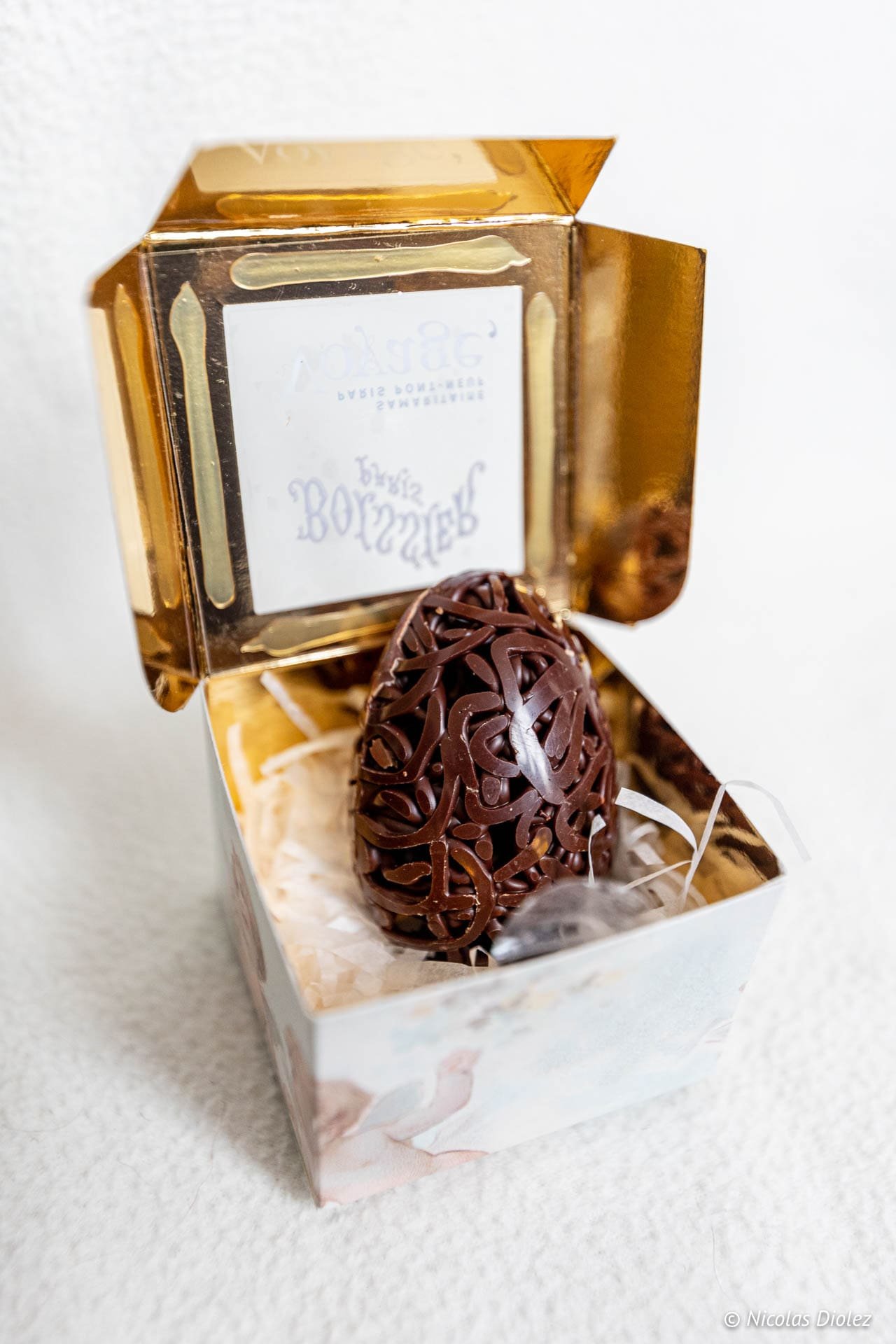 Intricate Boissier Easter chocolate egg in its gold box.
