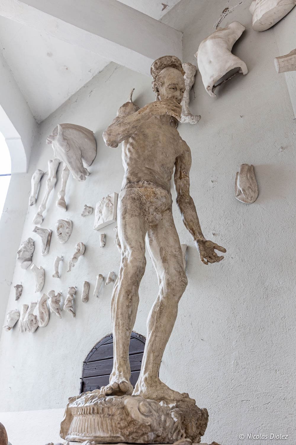 Framed portrait and sculptor's tools in the studio of the Château de la Napoule.