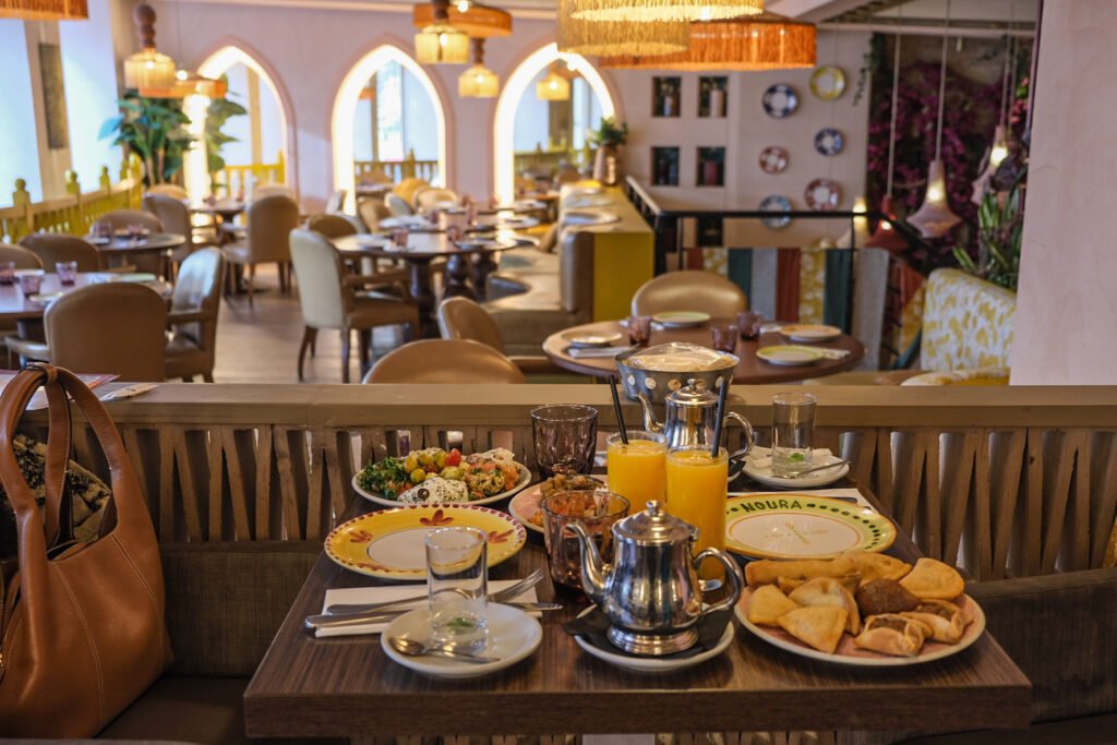 Lebanese brunch with mezze, orange juice, and mint tea at Noura Opéra in Paris.